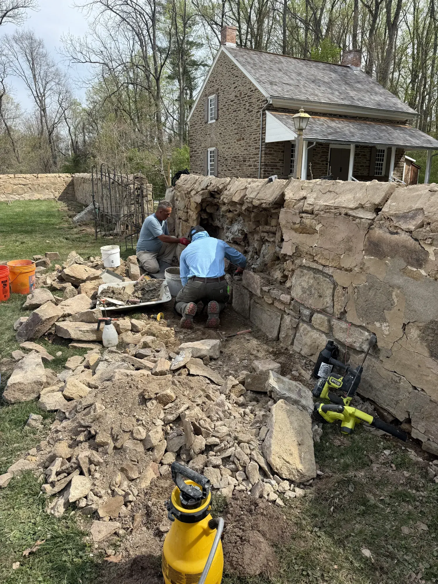 A. Pennacchi & Sons masons rebuilding a historic fieldstone wall at a historic stone property in New Jersey