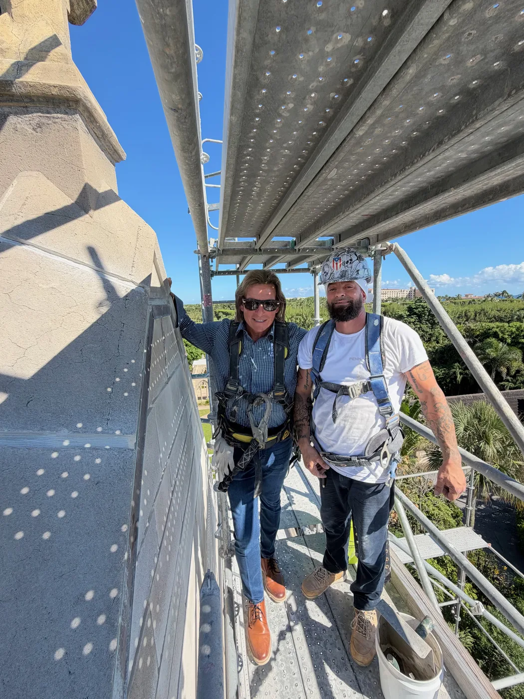 Paul Pennacchi Sr. and Paul Pennacchi Jr. on the scaffolding at the Church of Bethesda-by-the-Sea in Palm Beach, Florida