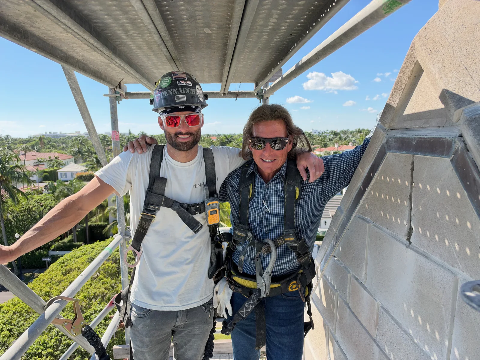 Paul Pennacchi Sr. and Paul Pennacchi Jr. above the stonework at the Church of Bethesda-by-the-Sea in Palm Beach, Florida