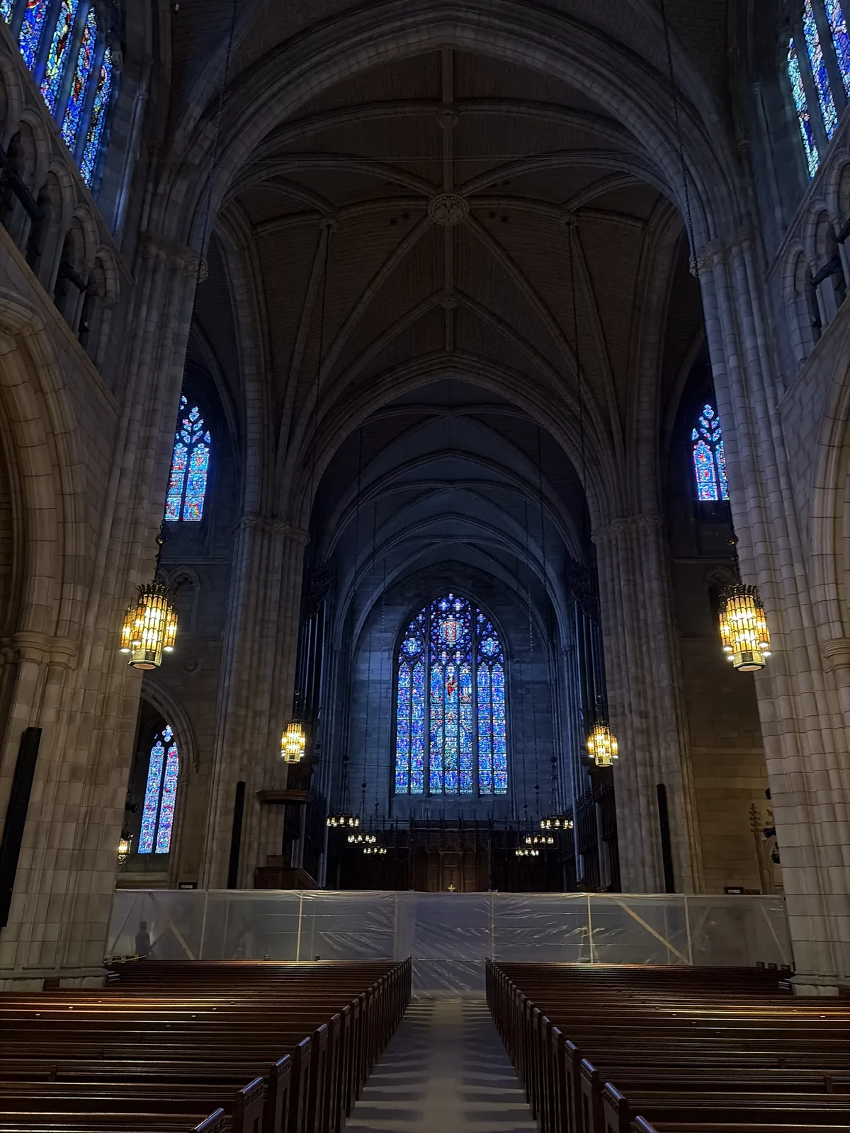 The nave of the Princeton University Chapel looking toward the chancel, with the protected work area in the foreground.