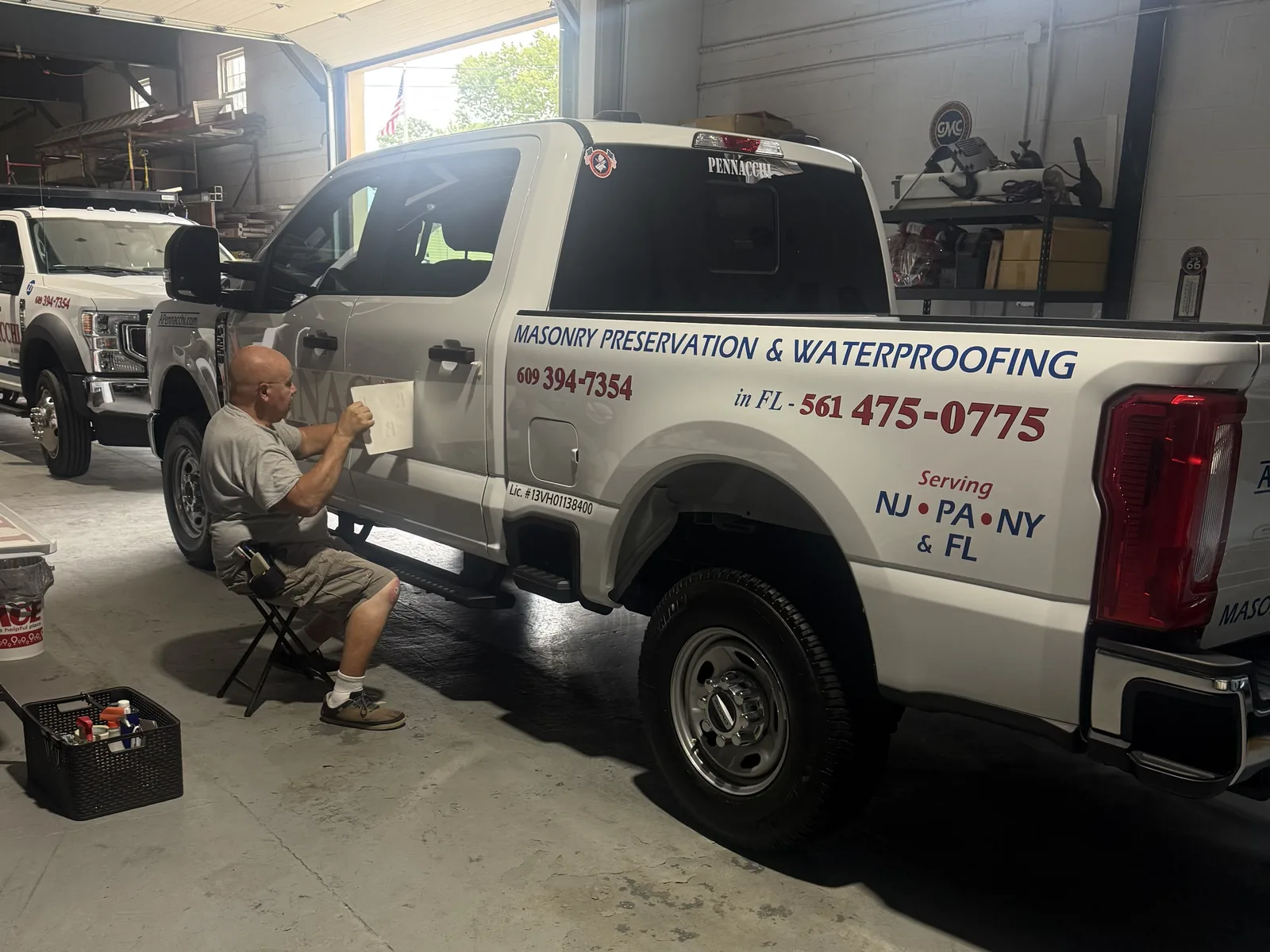 A. Pennacchi & Sons service truck lettered with masonry preservation and waterproofing signage at the company shop